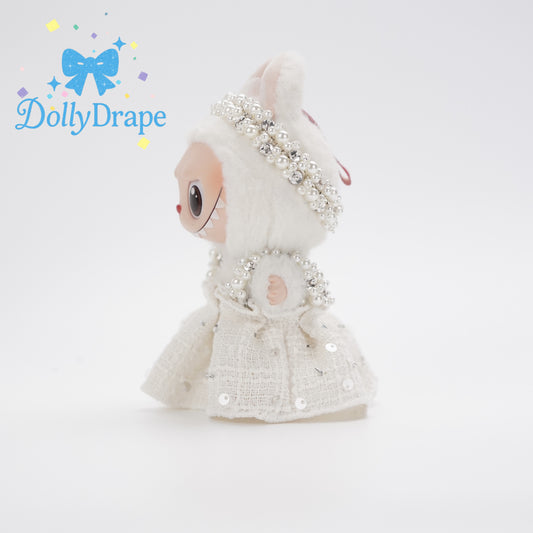 Side view of Labubu in vintage cream lace outfit