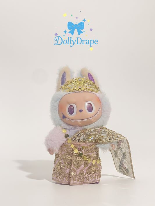 Labubu plush wearing gold traditional Thai outfit with head wrap and sash
